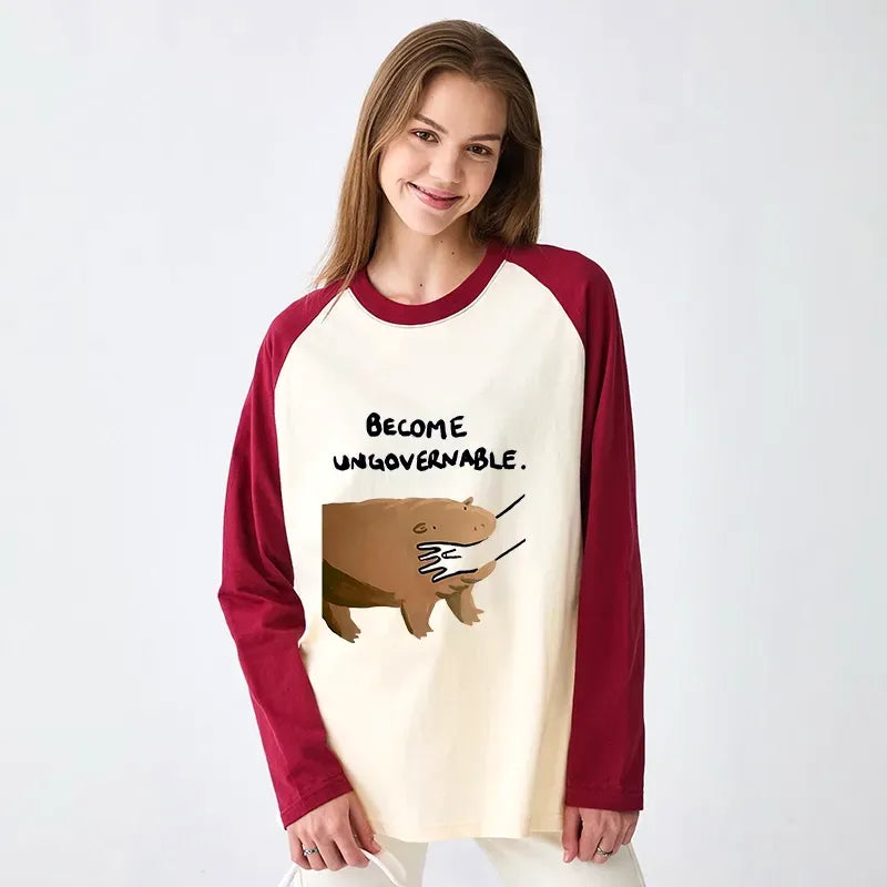 Kyoto-Lion Moo Deng Bites Someone's Arm Raglan Long Sleeve T-shirt