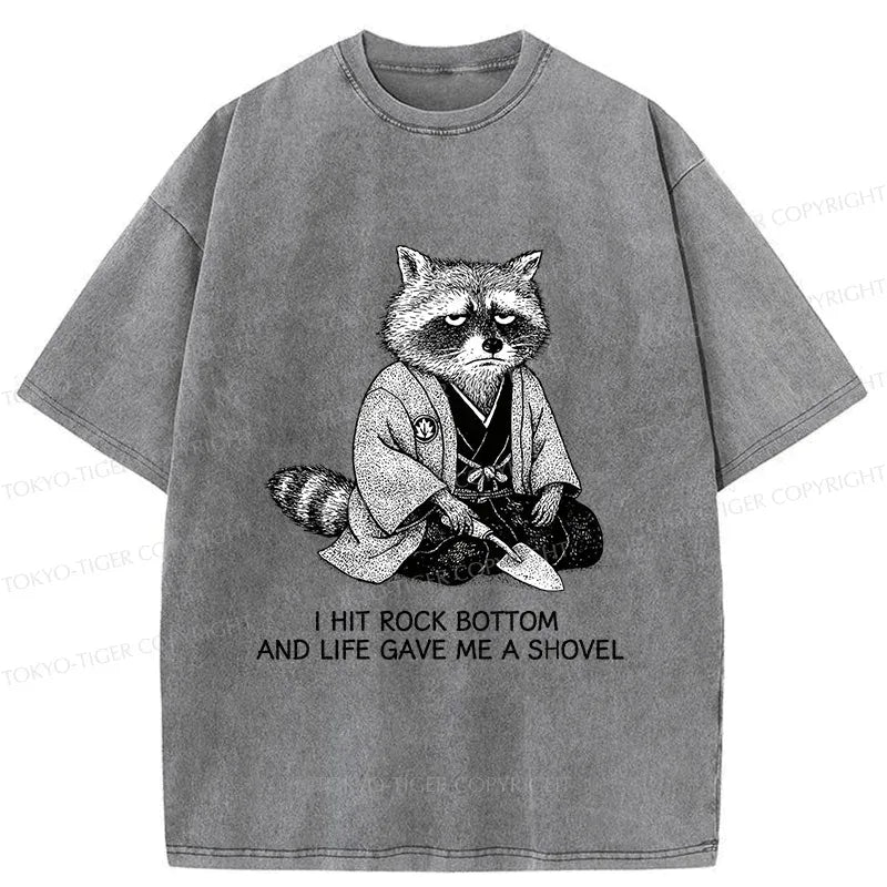 Raccoon holding shovel casual tee