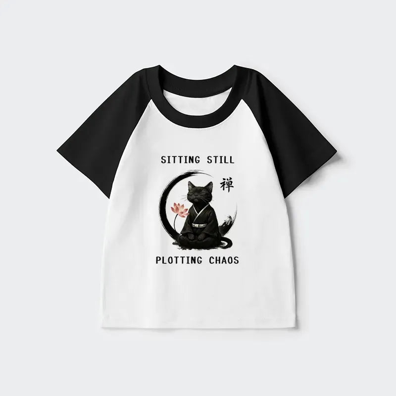 Kyoto-Lion Sitting still plotting chaos Calming Zen Cat Funny Kids Raglan T-shirt